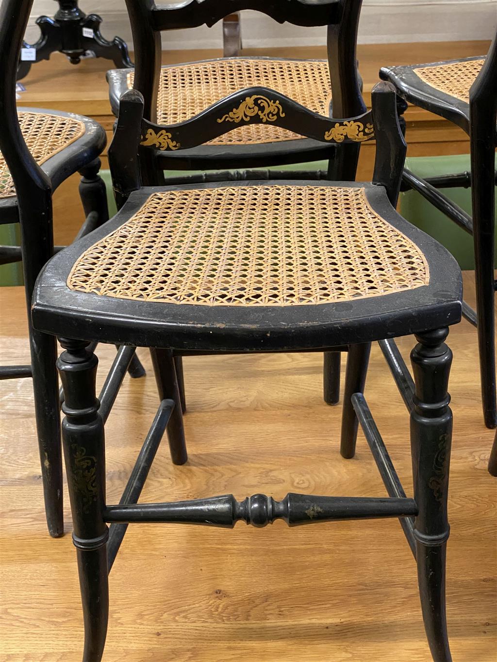 Nine Victorian mother of pearl inlaid lacquered caned seat side chairs